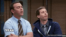 two men are standing next to each other and one of them has the word yeah above his head