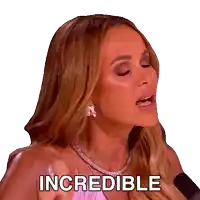a woman wearing a necklace and earrings is saying incredible