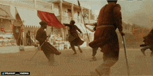 a group of men holding swords in front of a building that says pranav_varma on the bottom