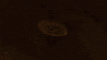 a blurred image of a candle being lit up in the dark