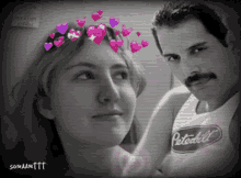 a black and white photo of a man and a woman with hearts on their head