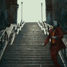 The Joker Joaquin Phoenix GIF - The Joker Joaquin Phoenix Going Down The Stares GIFs