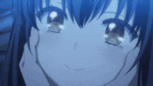 a close up of a girl 's face with her eyes closed
