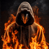 a man in a hooded sweatshirt with a mask on his face is surrounded by fire
