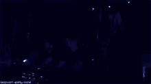 two men are dancing in a dark room with the words keepcalm-party-hard on the bottom right