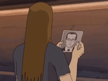 a cartoon of a woman holding a picture of a man