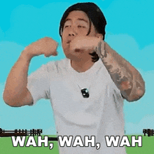 a man in a white shirt is making a funny face and says wah wah wah