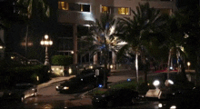 a few cars are parked in front of a building