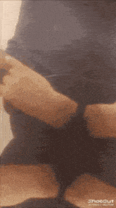a close up of a person 's arm with the words shotout at the bottom of the image