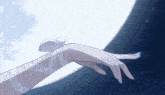 a woman 's hand is reaching out towards a full moon