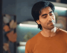 a close up of a man 's face with his eyes closed and his mouth open .