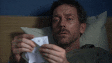 a man laying in bed with the words you are a ray of sunshine above him