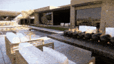 a patio with a fire pit and a swimming pool