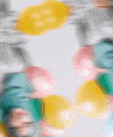 a blurred image of a person 's face with a yellow circle in the center