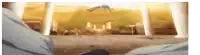 a blurry picture of a person standing in front of a building with a city in the background .