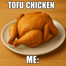 a fried chicken on a white plate with tofu chicken me written below it