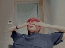 a young man with red hair is making a surprised face