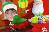 a cartoon of a boy dressed as an elf sitting next to santa