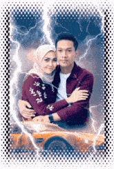 a man and a woman are hugging in front of a car