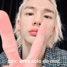 a close up of a person 's face with the words pov : eres solo de mar on the bottom