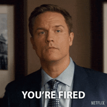 a man in a suit and tie says you 're fired on netflix