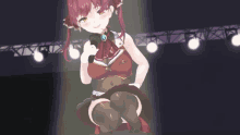 a girl with red hair is kneeling down with a microphone