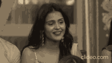 a black and white photo of a woman with clideo.com written on the bottom right