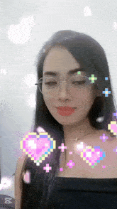 a woman wearing glasses and a black top is surrounded by pixelated hearts and the letter m