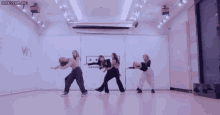 a group of girls are dancing in front of a sign that says secm