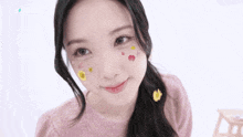 a close up of a girl with flowers on her face
