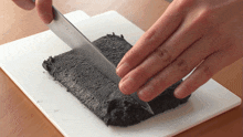 cutting the black sesame paste two plaid aprons chopping sesame paste prepping the paste