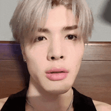 a close up of a person 's face with pink lipstick on their lips