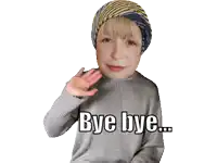 a girl wearing a sweater and a head scarf says bye bye