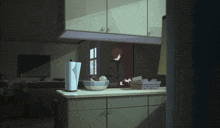 a kitchen with a paper towel holder and a bowl of fruit on the counter