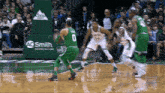 a basketball game is being played in front of an ad for ag smith