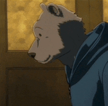 a cartoon bear wearing a blue hoodie is standing in front of a window .