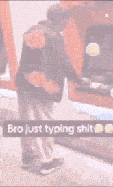 a man is typing on an atm machine and the words bro just typing shit are visible