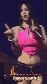 a woman in a pink top is dancing in front of a dance youth logo