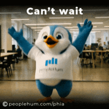 a penguin mascot is wearing a white shirt that says people hum
