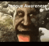a picture of a man with his tongue out and the words tongue awareness above him
