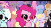 a cartoon of pinkie pie surrounded by other ponies with big eyes