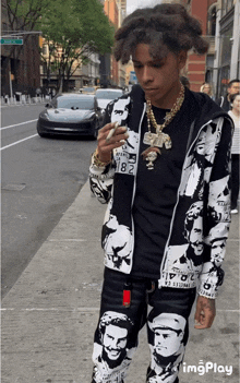 a man wearing a jacket with the number 82 on it is walking down the street