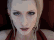 a close up of a woman 's face with blonde hair and blue eyes