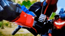 a close up of a robot 's arm with a red and blue stripe