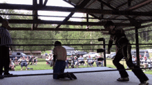 a man in a skeleton costume stands in a boxing ring
