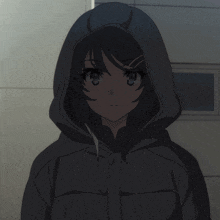 a girl in a black jacket with a hood