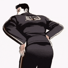 a man is standing with his hands on his hips wearing a black jacket with the letter r on the back