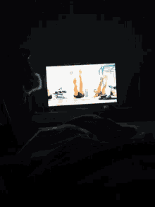a person is watching a movie on a screen with a man in a yellow shirt that says ' a ' on it