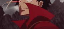 a close up of a person 's face in a cartoon with a red cape .