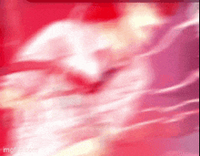 a red and white background with a blurred image of a person 's face